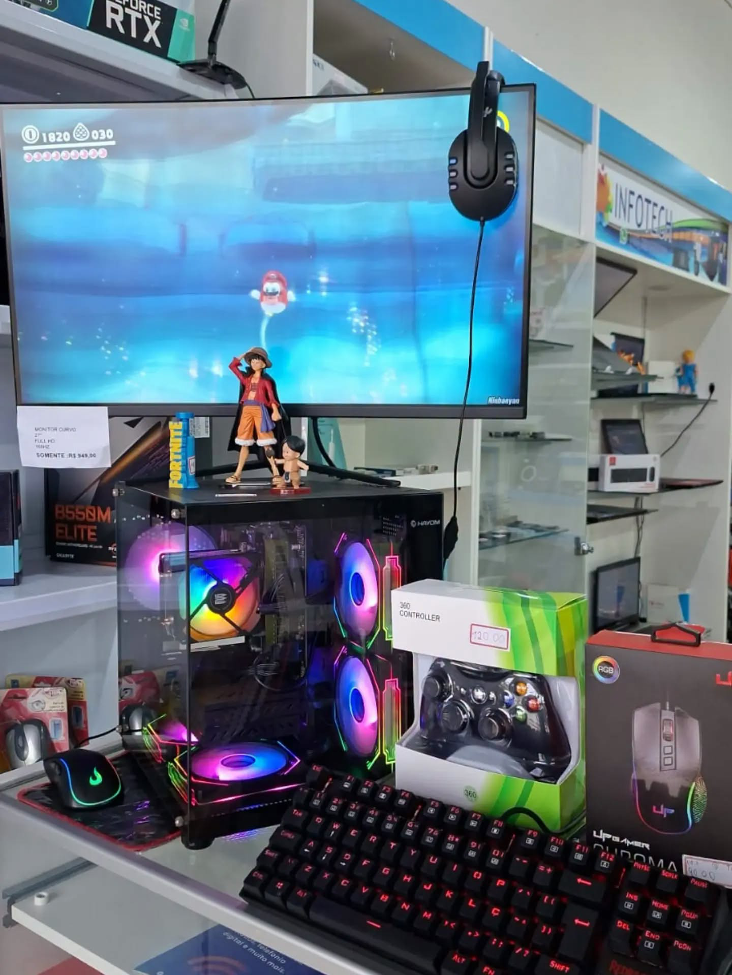 PC gamer montado com monitor curvo, headset e teclado mecânico à venda na Infotech Corbélia